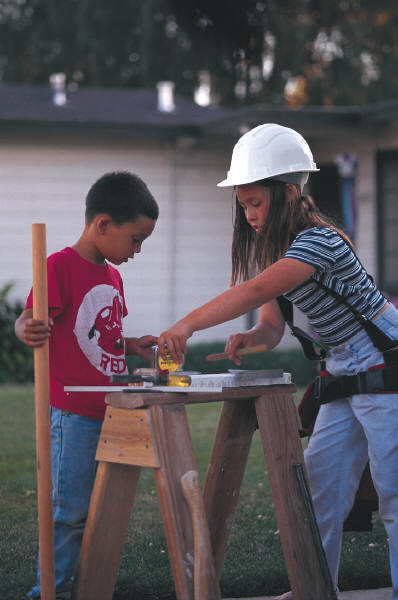 Two children building